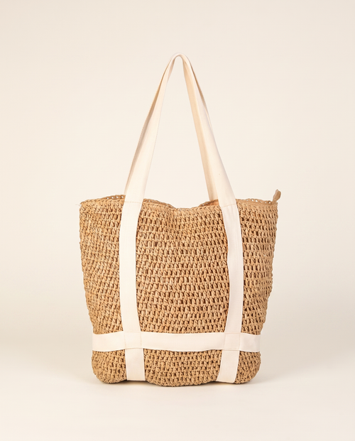Braided Straw Beach Tote on a warm ivory studio background