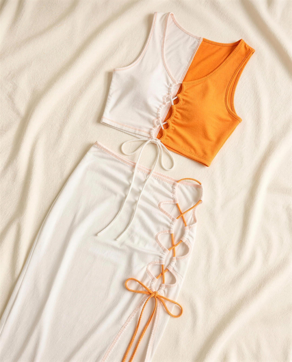 Colour-Block lace-up crop top and maxi skirt flat-lay showing the colour-block panels and lace-up detail