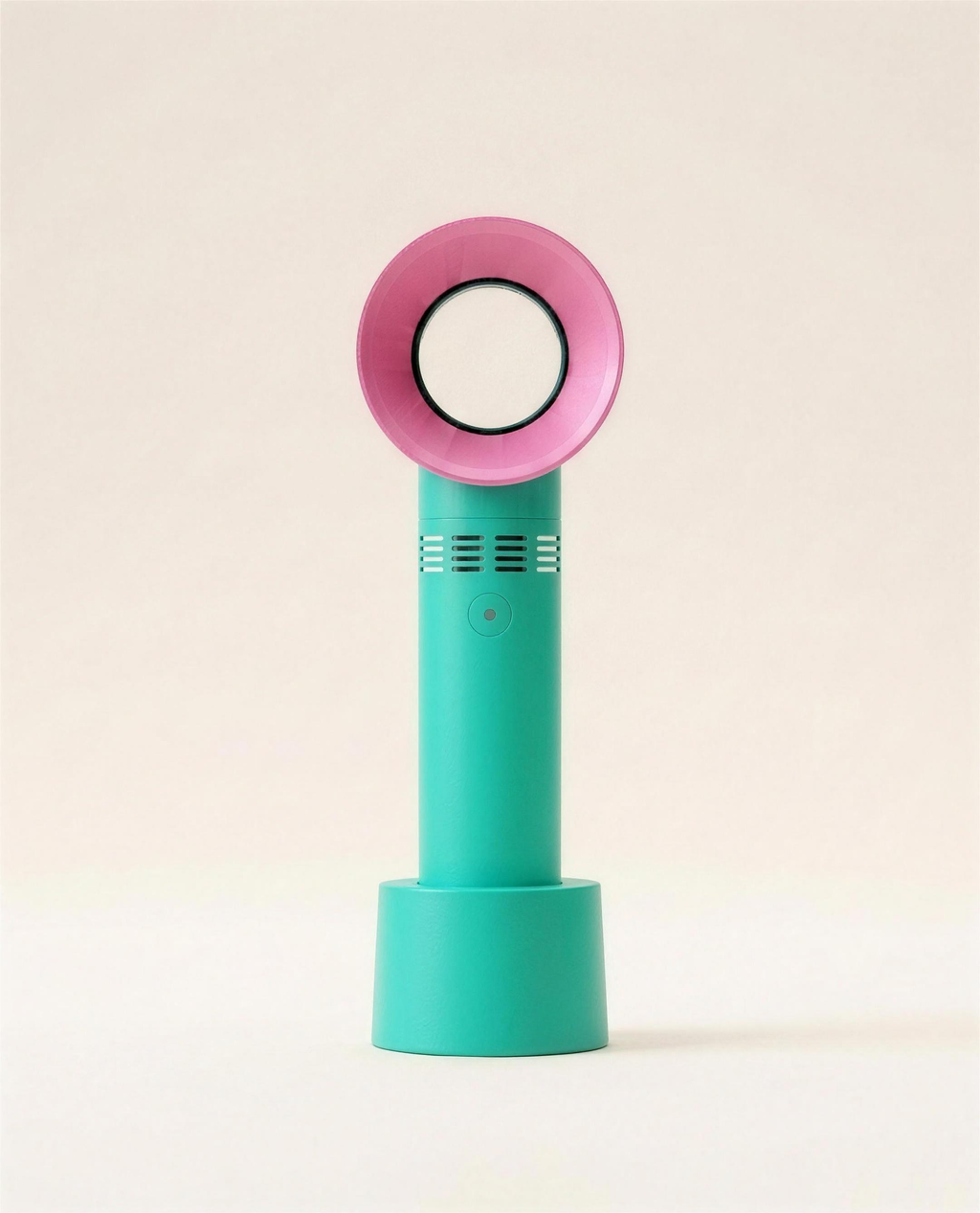 Bladeless portable USB fan in green on a warm ivory studio background