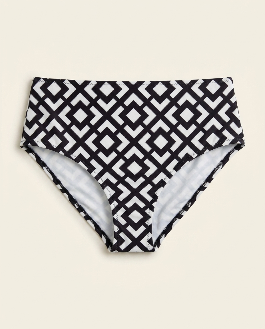 High-waist geometric print bikini bottom on warm ivory