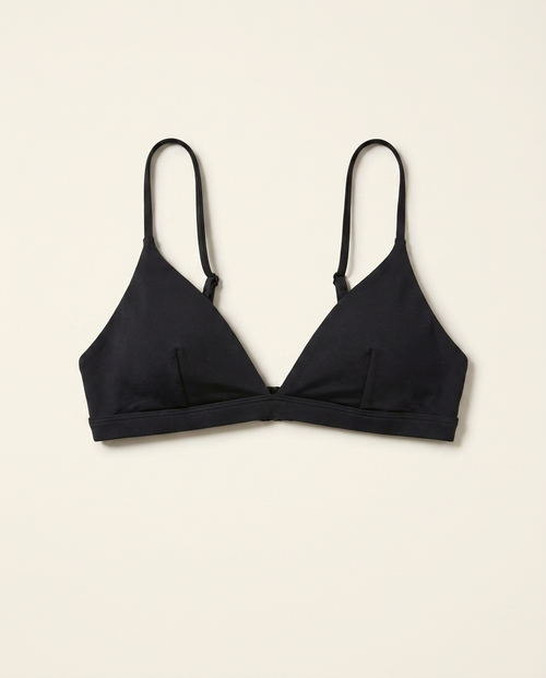 Black triangle bralette bikini top on warm ivory