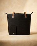 Hidden wine dispenser bag in black on a warm ivory background