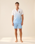 Men's casual beach shorts set worn by a model on a warm ivory background