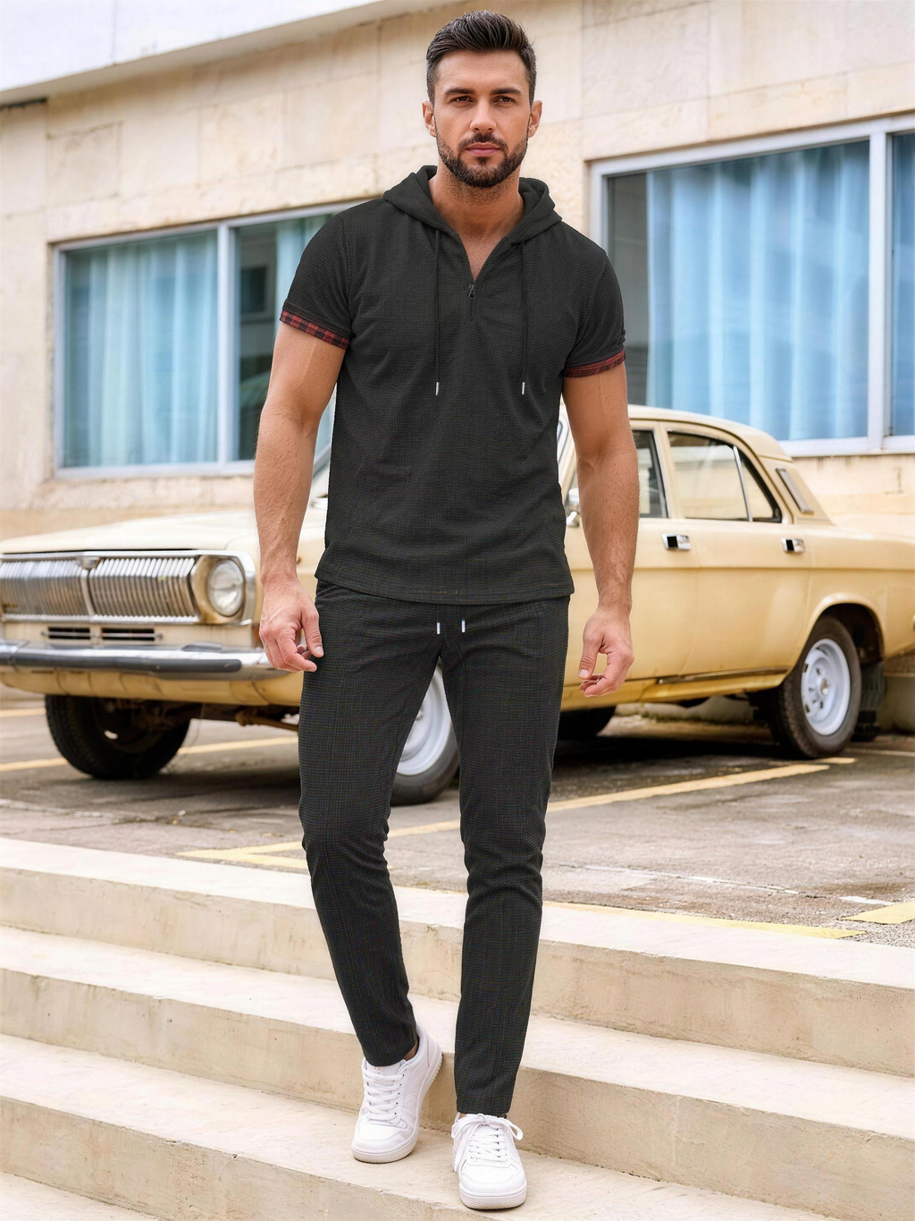 Men's black short-sleeve hooded top and pants set on model