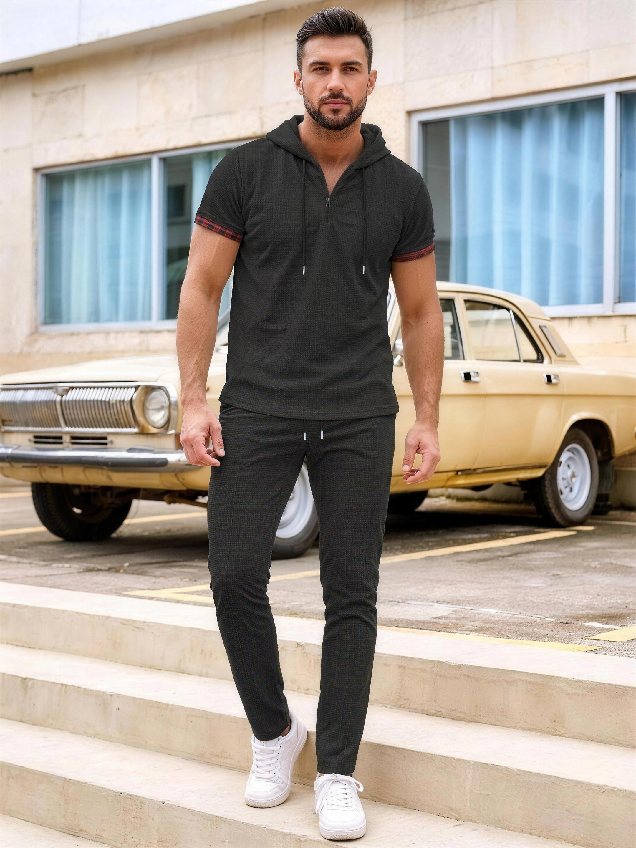 Men's black short-sleeve hooded top and pants set on model
